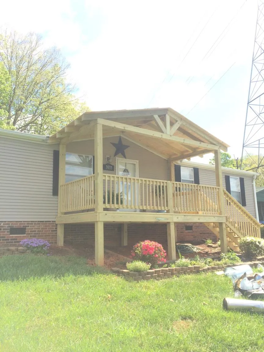 New gabled porch roof and deck railing added to a ranch home in Fairfield